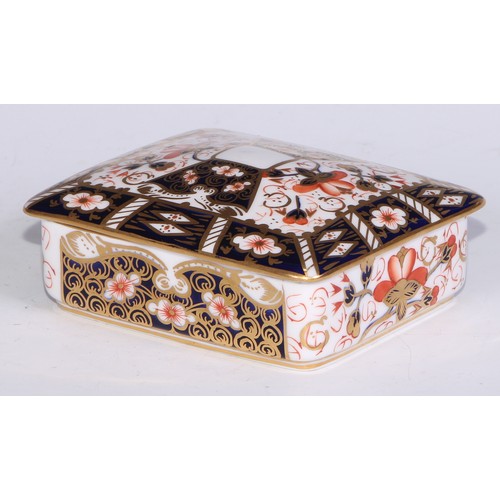 605 - A pair of Royal Crown Derby Imari square bombe shaped boxes and covers, 8cm wide, printed marks; ano... 