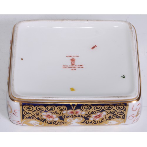 605 - A pair of Royal Crown Derby Imari square bombe shaped boxes and covers, 8cm wide, printed marks; ano... 