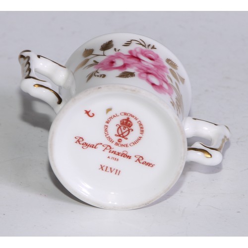 792 - A Sampson Hancock Derby miniature model, of a watering can, painted with roses, 9.5cm high, red mark... 