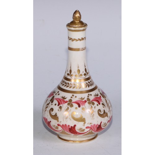 708 - A pair of Derby compressed globular scent bottles, decorated in pink and gilt with flowers and scrol... 