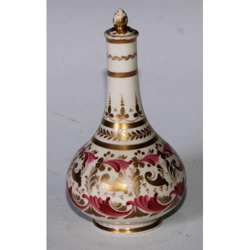 708 - A pair of Derby compressed globular scent bottles, decorated in pink and gilt with flowers and scrol... 