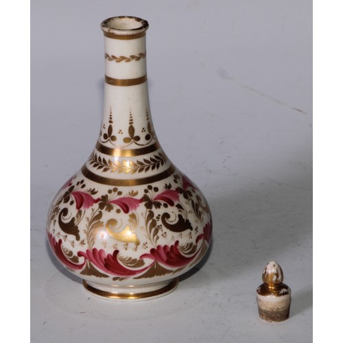 708 - A pair of Derby compressed globular scent bottles, decorated in pink and gilt with flowers and scrol... 