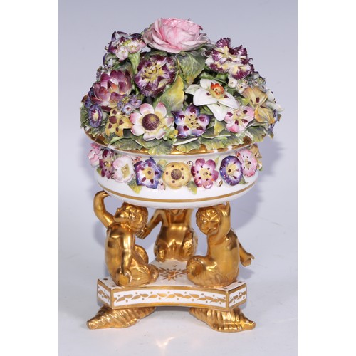 781 - A Sampson Hancock Derby faux pot pourri, encrusted with summer flowers, triform base with merman sup... 