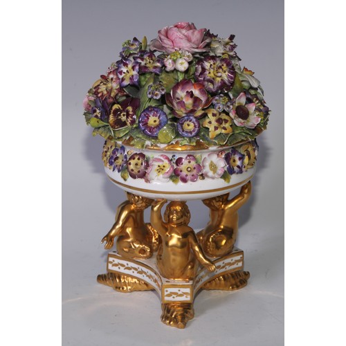 781 - A Sampson Hancock Derby faux pot pourri, encrusted with summer flowers, triform base with merman sup... 