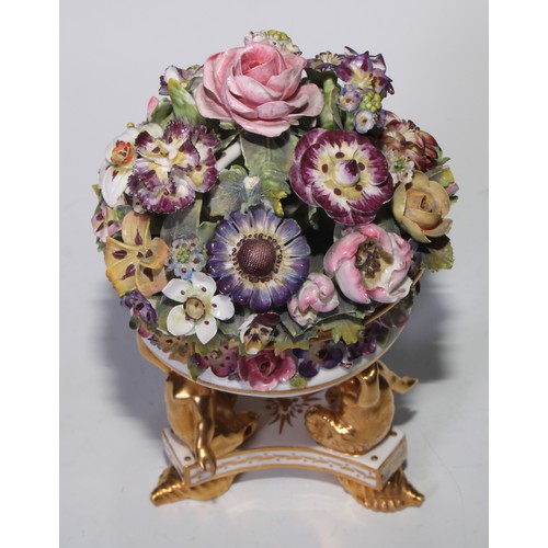 781 - A Sampson Hancock Derby faux pot pourri, encrusted with summer flowers, triform base with merman sup... 