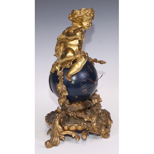 541 - A Napoleon III ormolu and japanned mantel clock, cast as a Bacchic putto atop a celestial orb draped... 