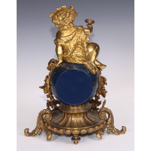 541 - A Napoleon III ormolu and japanned mantel clock, cast as a Bacchic putto atop a celestial orb draped... 