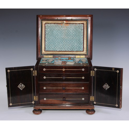 387 - A George IV rosewood and mother of pearl sarcophagus table cabinet, hinged cover above a pair of doo... 