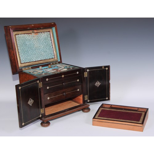 387 - A George IV rosewood and mother of pearl sarcophagus table cabinet, hinged cover above a pair of doo... 