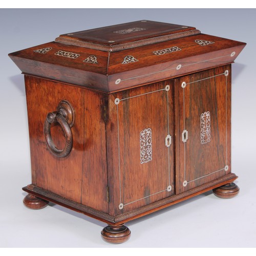 387 - A George IV rosewood and mother of pearl sarcophagus table cabinet, hinged cover above a pair of doo... 