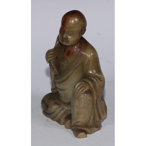 382 - A Chinese soapstone figure, of a monk, seated, parting his robe, Buddha displayed on his chest, 12.5... 