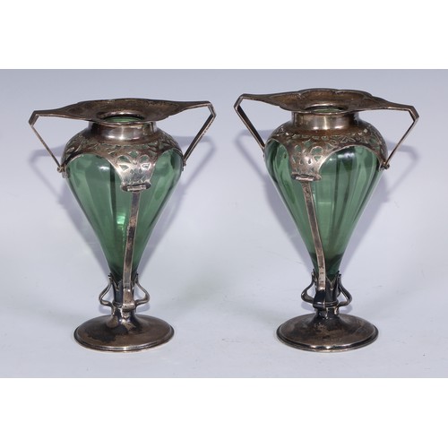 542 - A pair of Art Nouveau silver mantel vases, canted angular handles, whiplash-pierced mounts, circilar... 