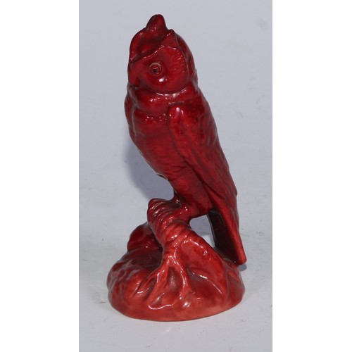 724 - A Bernard Moore flambe model, of an owl perched on a root, 9cm high, impressed mark