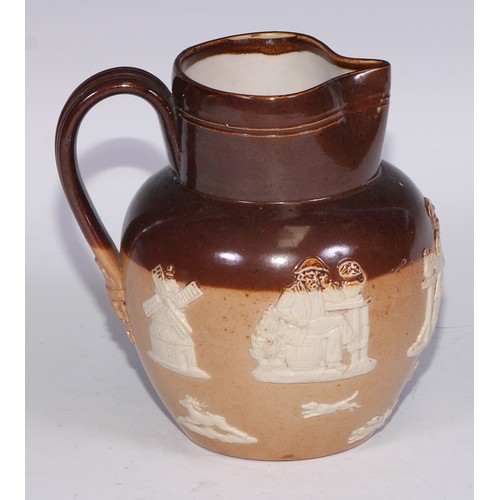 747 - A Royal Doulton brown and buff salt glazed stoneware ovoid harvest jug, typically sprigged with joll... 