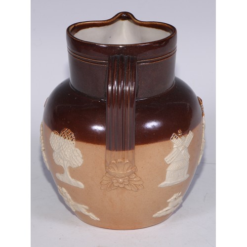 747 - A Royal Doulton brown and buff salt glazed stoneware ovoid harvest jug, typically sprigged with joll... 