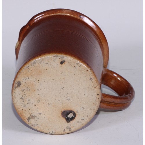 747 - A Royal Doulton brown and buff salt glazed stoneware ovoid harvest jug, typically sprigged with joll... 