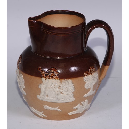 747 - A Royal Doulton brown and buff salt glazed stoneware ovoid harvest jug, typically sprigged with joll... 