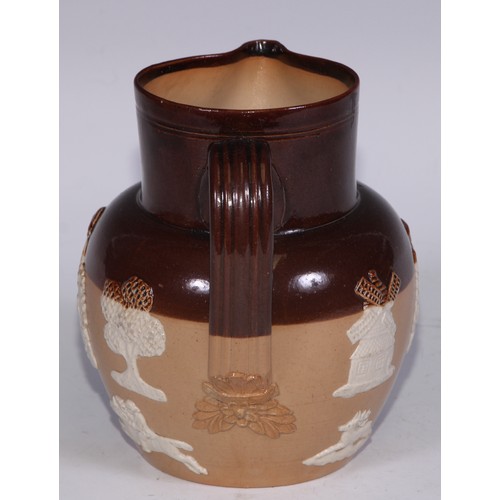 747 - A Royal Doulton brown and buff salt glazed stoneware ovoid harvest jug, typically sprigged with joll... 