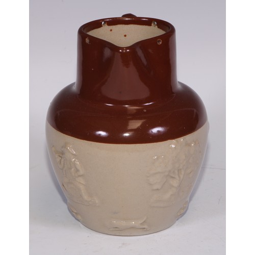 747 - A Royal Doulton brown and buff salt glazed stoneware ovoid harvest jug, typically sprigged with joll... 