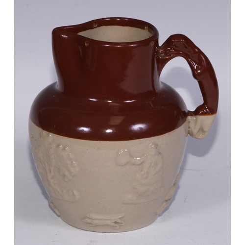 747 - A Royal Doulton brown and buff salt glazed stoneware ovoid harvest jug, typically sprigged with joll... 