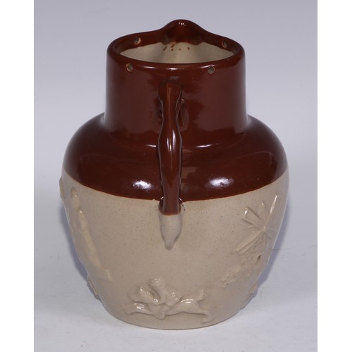 747 - A Royal Doulton brown and buff salt glazed stoneware ovoid harvest jug, typically sprigged with joll... 