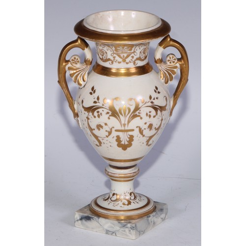 673 - A Derby campana vase, painted with a spray of roses and summer flowers, gilt serpent handles, 17cm h... 