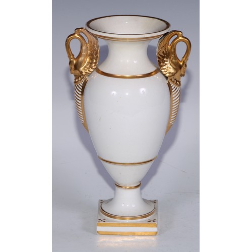 673 - A Derby campana vase, painted with a spray of roses and summer flowers, gilt serpent handles, 17cm h... 