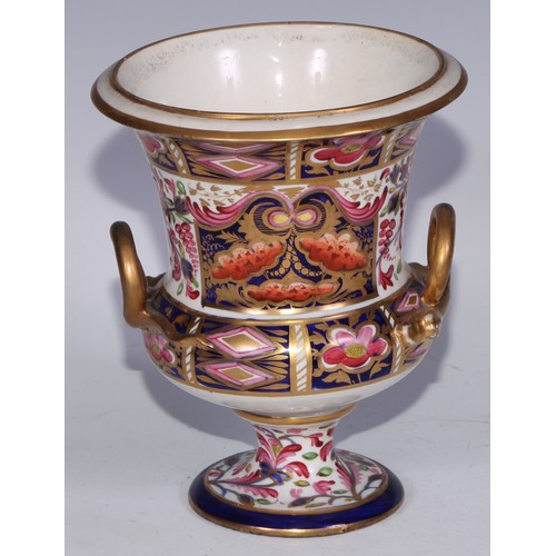 700 - A garniture of three Derby campana vases, painted in the Imari palette, the largest 20.5cm high, red... 