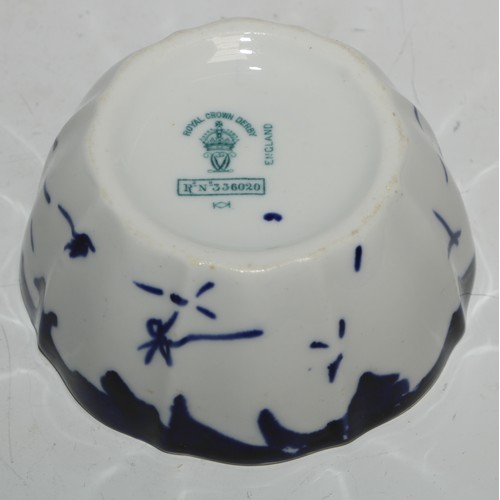 630 - A Royal Crown Derby cylindrical tobacco jar, Virginia Cigarettes, transfer printed in underglaze blu... 