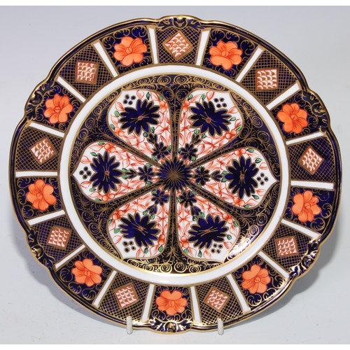 615 - A Royal Crown Derby 1128 pattern shaped circular dessert plate, 23cm diam, printed mark in pink; ano... 