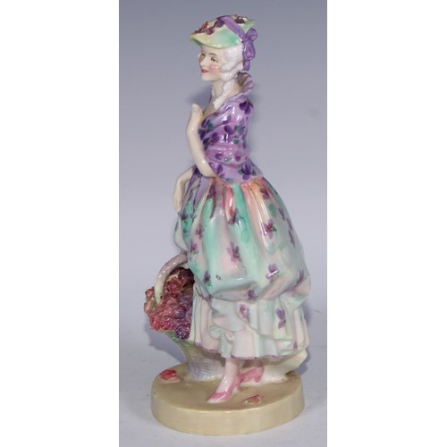 753 - A Royal Doulton figure, Spring Flowers, 18.5cm high, HN1807; others, Phyllis and The Bridesmaid (3)