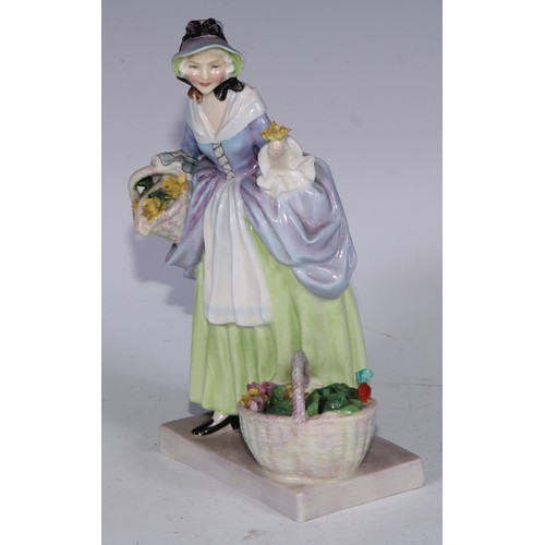 753 - A Royal Doulton figure, Spring Flowers, 18.5cm high, HN1807; others, Phyllis and The Bridesmaid (3)