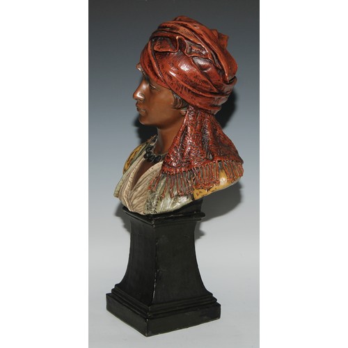 762 - A Goldscheider Art Nouveau terracotta bust, of a young girl in Eastern dress, spreading square socle... 