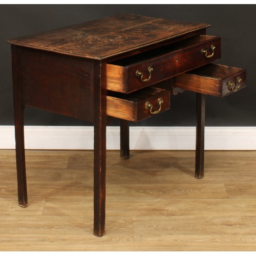 423 - A George III oak lowboy, rectangular top above three drawers, shaped apron, internally chamfered leg... 