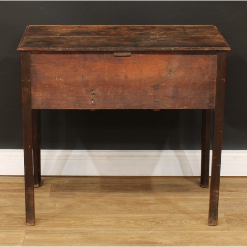 423 - A George III oak lowboy, rectangular top above three drawers, shaped apron, internally chamfered leg... 