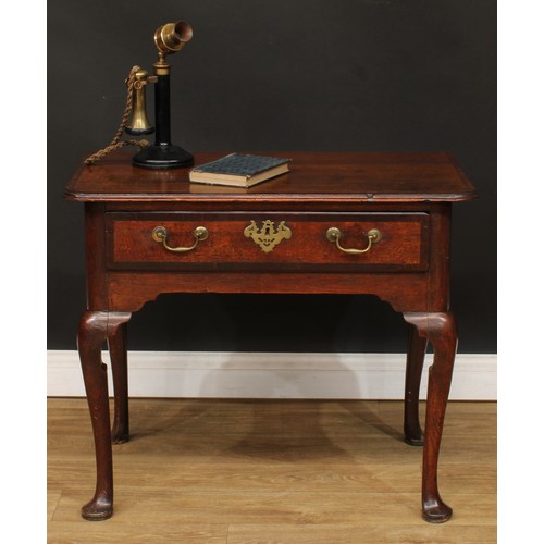 418 - A George III mahogany crossbanded oak side table, slightly oversailing top above a long drawer, bras... 