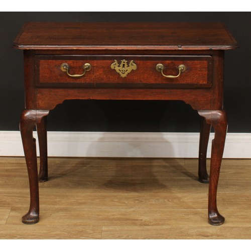 418 - A George III mahogany crossbanded oak side table, slightly oversailing top above a long drawer, bras... 