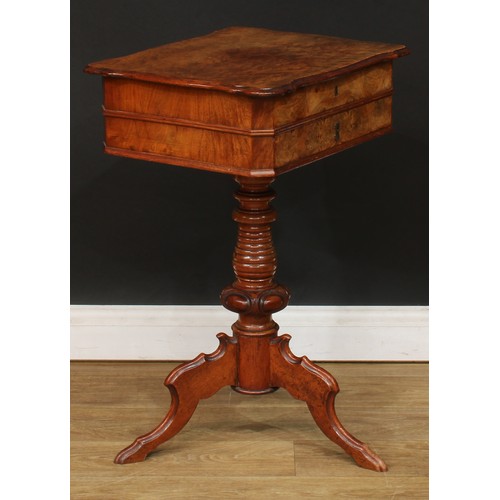 347 - A 19th century walnut and mahogany work table, hinged top enclosing a sliding compartmented interior... 