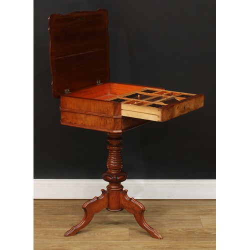 347 - A 19th century walnut and mahogany work table, hinged top enclosing a sliding compartmented interior... 