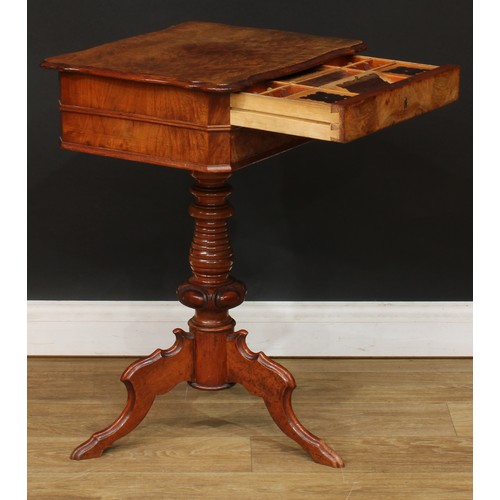 347 - A 19th century walnut and mahogany work table, hinged top enclosing a sliding compartmented interior... 