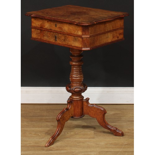 347 - A 19th century walnut and mahogany work table, hinged top enclosing a sliding compartmented interior... 