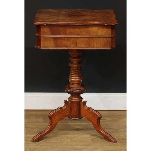 347 - A 19th century walnut and mahogany work table, hinged top enclosing a sliding compartmented interior... 