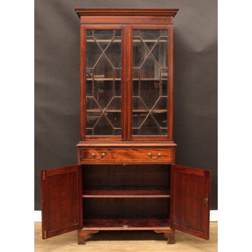 474 - A Sheraton Revival mahogany and marquetry library bookcase, dentil cornice above a pair of astragal ... 