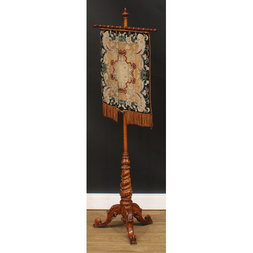 495 - A Victorian walnut pole screen, bead and woodwork banner, spirally turned column, cabriole legs carv... 