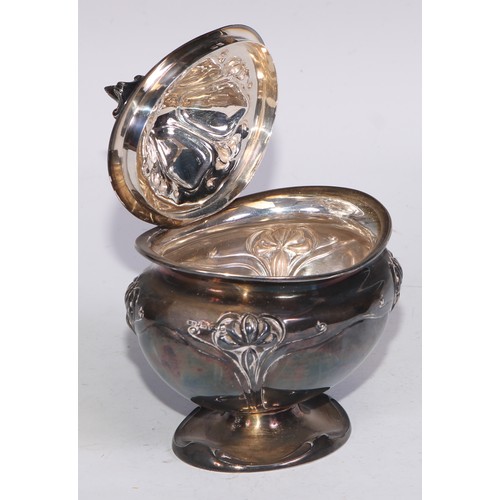 24 - An Art Nouveau silver bombe shaped tea caddy, embossed with stylised flowers on whiplash stems, hing... 