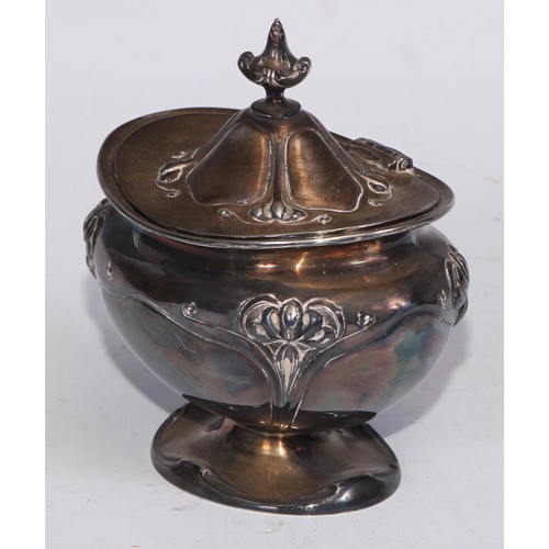 24 - An Art Nouveau silver bombe shaped tea caddy, embossed with stylised flowers on whiplash stems, hing... 