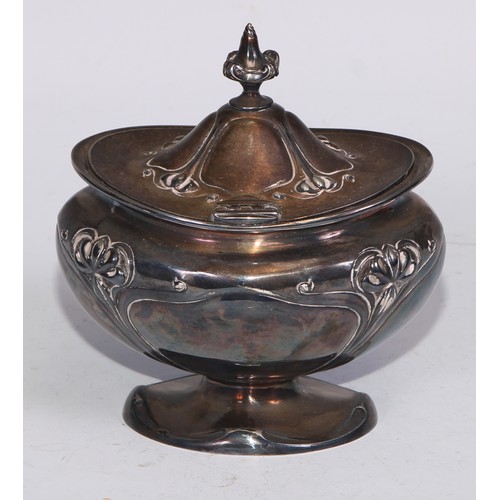 24 - An Art Nouveau silver bombe shaped tea caddy, embossed with stylised flowers on whiplash stems, hing... 