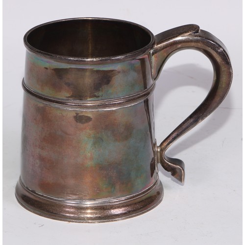 18 - A Queen Anne Britannia silver mug, quarter girdle, S-scroll handle, skirted base, 12cm high, Anthony... 