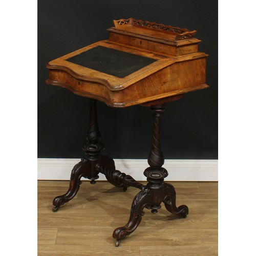 493 - A Victorian walnut ‘Davenport’ desk, hinged rectangular superstructure with shaped and pierced galle... 