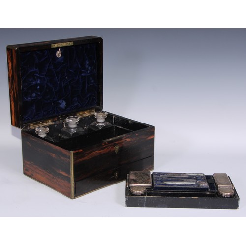 394 - A Victorian brass bound coromandel rectangular dressing box, hinged cover enclosing an arrangement o... 